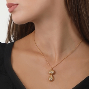 Archaics short gold plated necklace with carved heart and drop-