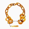 Impress Me chain necklace, amber resin rings with hanging drop motif and zinc metal parts