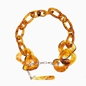 Impress Me chain necklace, amber resin rings with hanging drop motif and zinc metal parts-