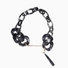 Impress Me chain necklace, black resin rings with hanging drop motif and zinc metal parts